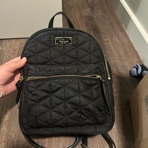 Kate Spade black quilted backpack.